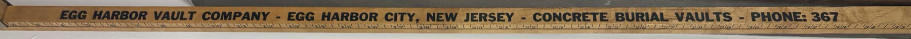 Wooden yardstick printed: Egg Harbor Vault Company, Egg Harbor City, New Jersey, Concrete Burial Vaults, Phone: 367